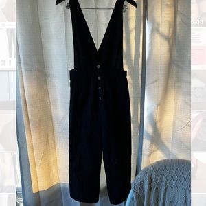 Black low neck button up romper